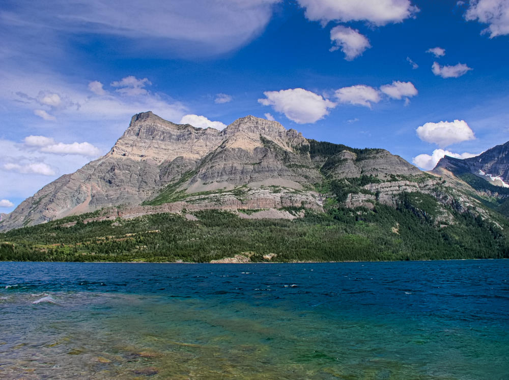 Vimy Mountain under front lighting, viewed from across the lake near the townsite of Waterton in Waterton Lakes National Park.