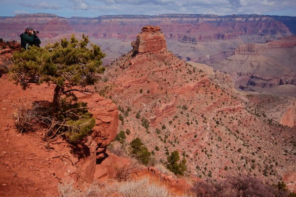 Happy landscape photographer aiming eastward from Cedar Ridge on the Grand Canyon's South Kaibab Trail